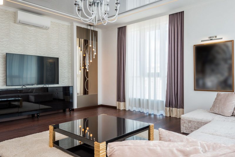 Contemporary living room with warm wood tones and a subtle wall finish